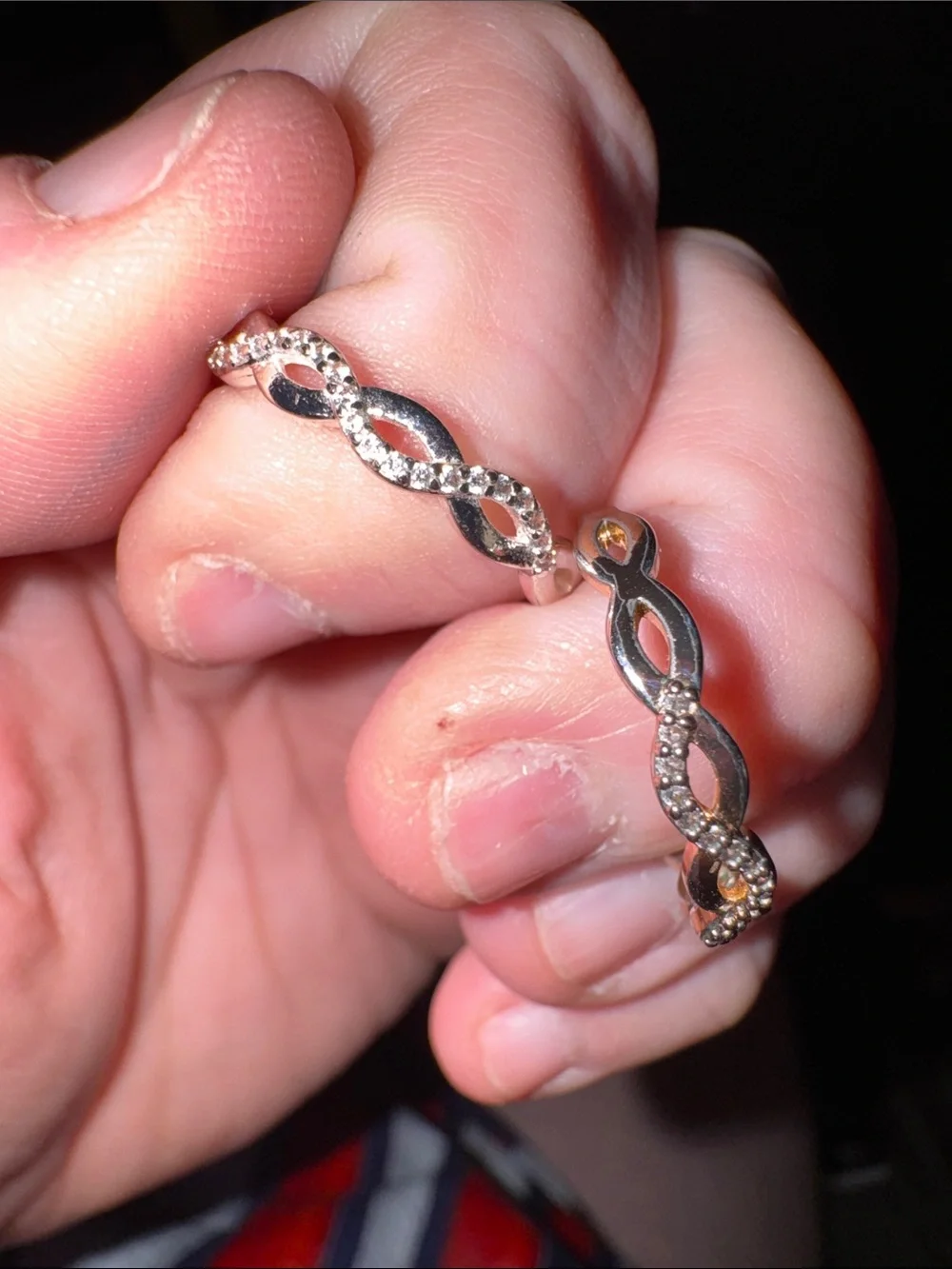 Size unknown: Silver and gold toned infinity rings- 2 rings